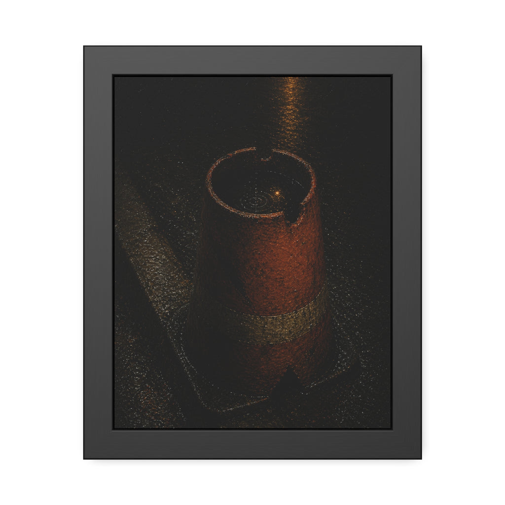 An upturned traffic cone holding rainwater at a wet curb under a lamp. The Cup of Rain by Garabaggio, framed fine art print, 11″ x 14″.