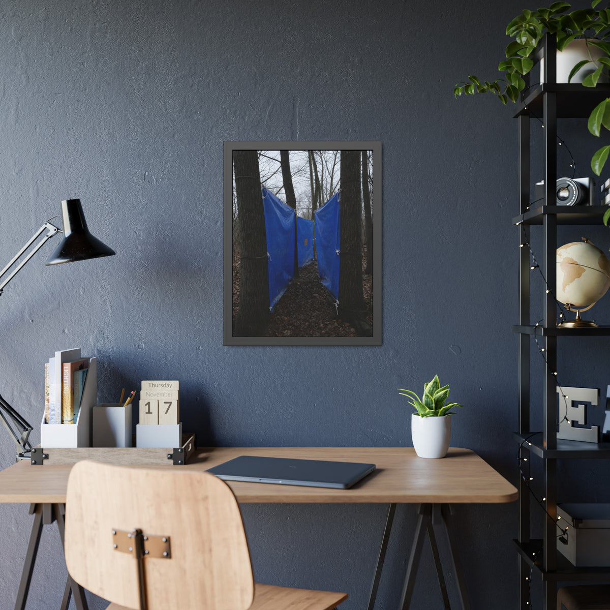 Blue tarps tied between bare trees forming a corridor over dead leaves. Passage Between Trees by Garabaggio, framed fine art print hanging in a room.