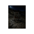A rusted shopping cart sunk in cracked dried mud under a full moon. The Silting by Garabaggio, fine art print, 12″ x 16″.