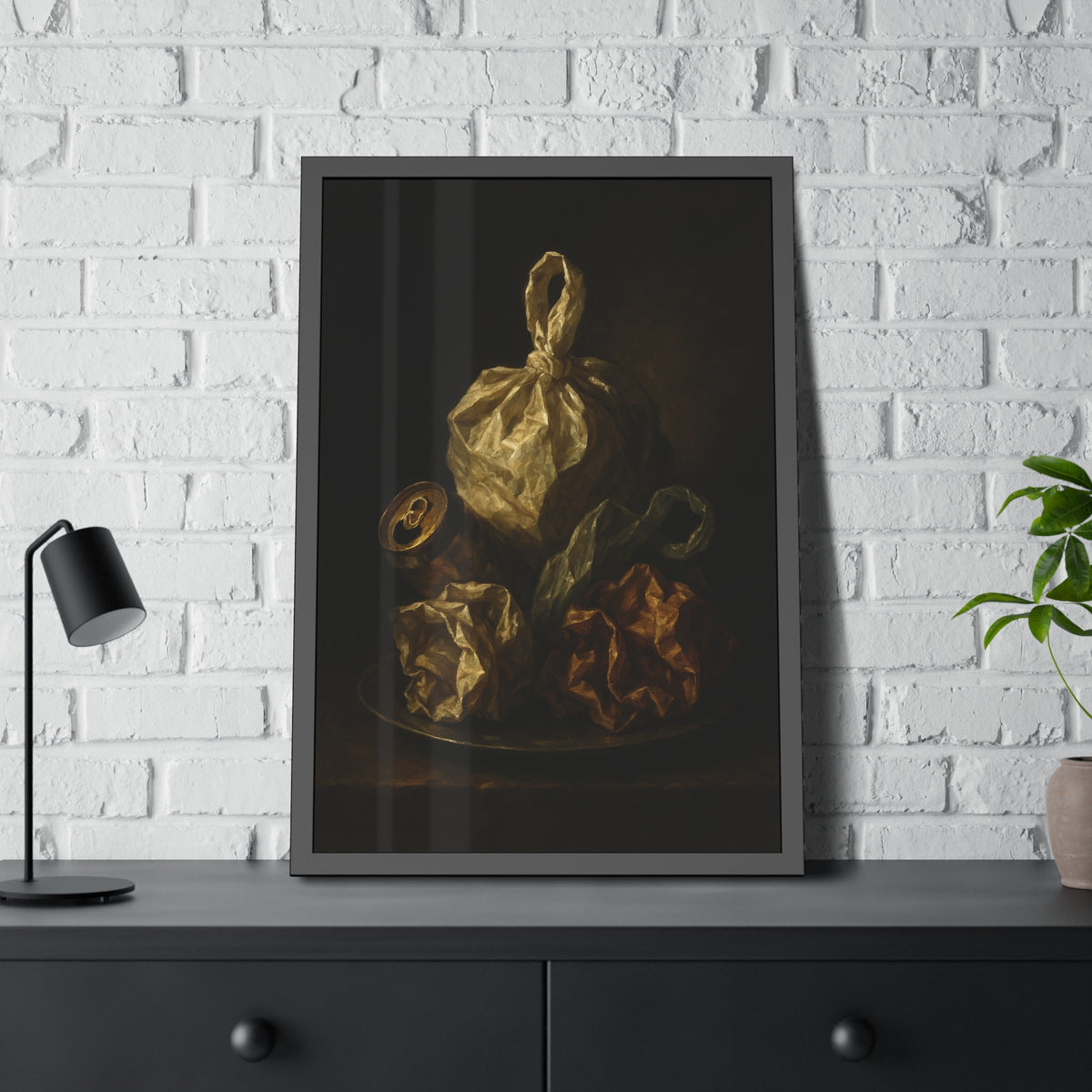 Knotted plastic bag on a plate with crumpled wrappers and a crushed can. Communion of the Knotted Bag by Garabaggio, framed fine art print hanging in a room.