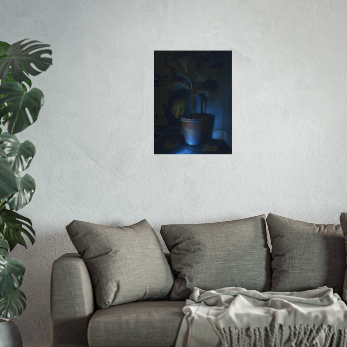 A dying potted plant in a corner washed in blue television light. The Television Hours by Garabaggio, fine art print hanging in a room.