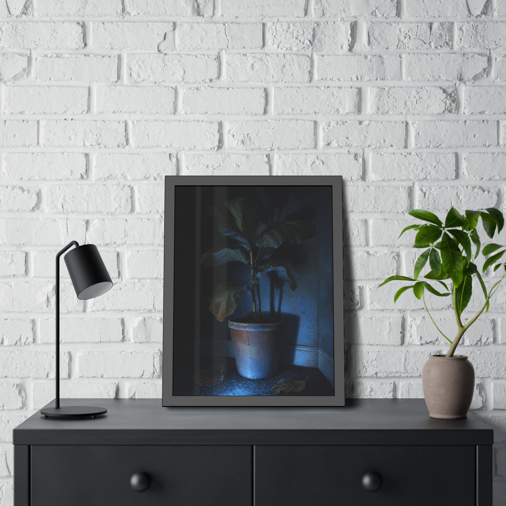 A dying potted plant in a corner washed in blue television light. The Television Hours by Garabaggio, framed fine art print hanging in a room.