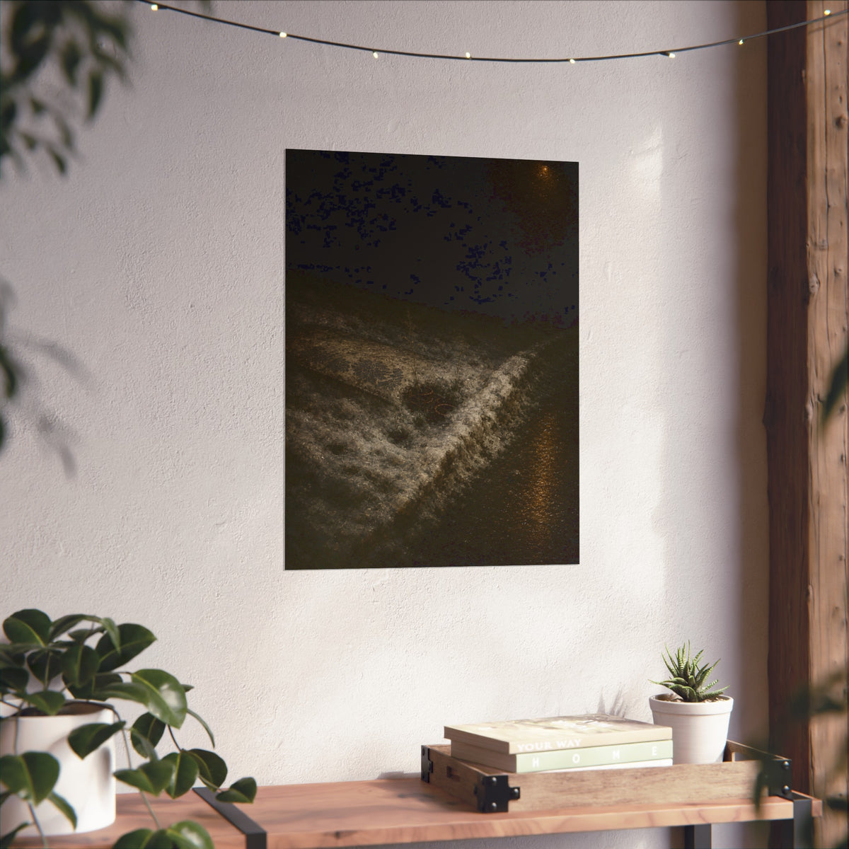 A discarded mattress half buried in snow, a distant streetlight behind. The White Burial by Garabaggio, fine art print hanging in a room.