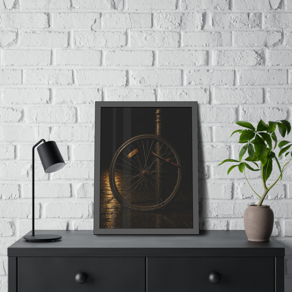 A bent bicycle wheel locked to a post on wet pavement. The Last Lock by Garabaggio, framed fine art print hanging in a room.