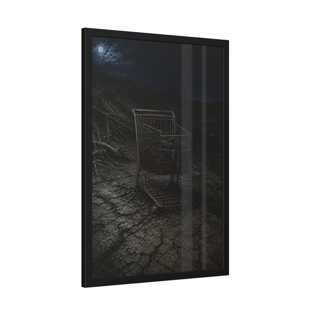 A rusted shopping cart sunk in cracked dried mud under a full moon. The Silting by Garabaggio, framed fine art print hanging in a room.