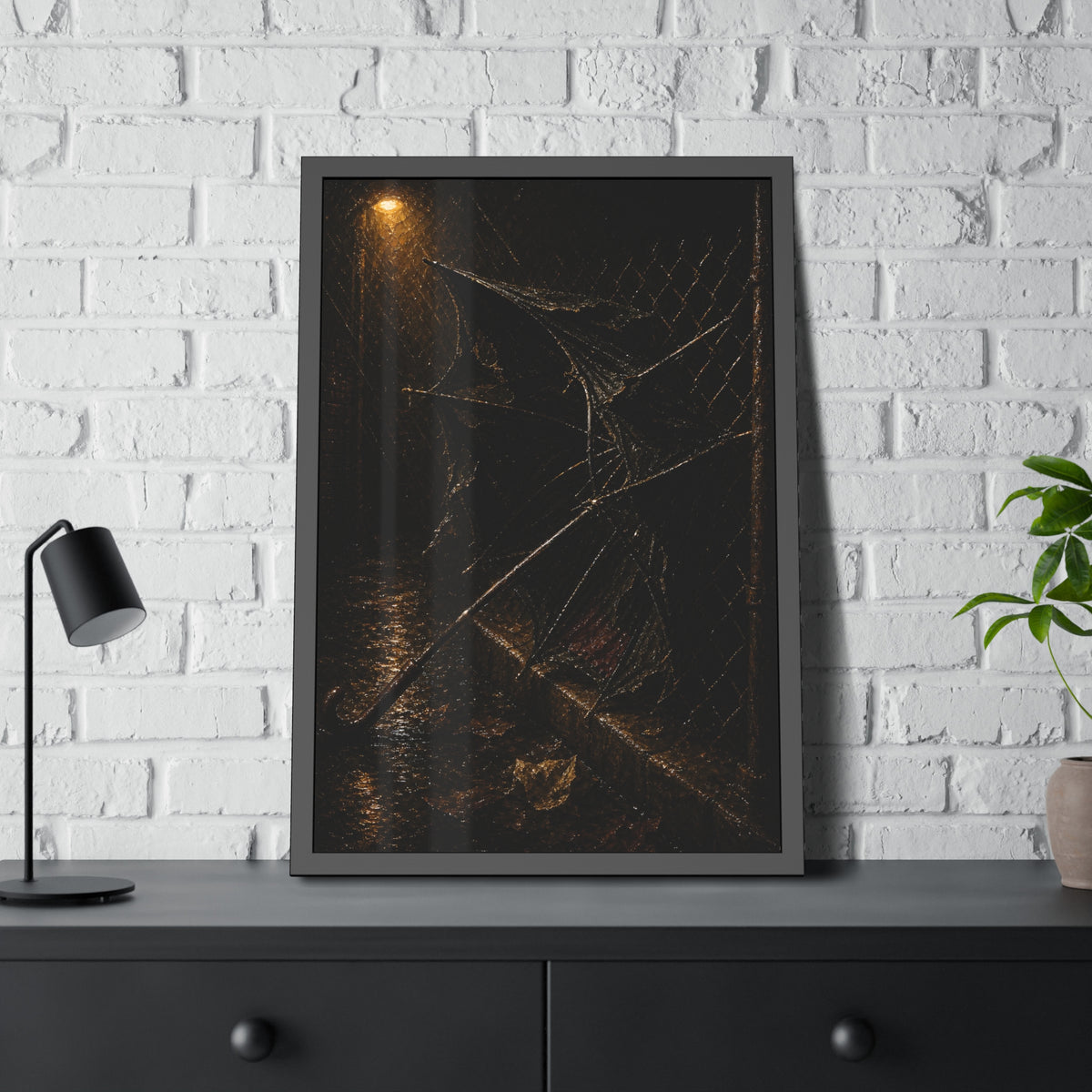 A broken umbrella pinned to a chain link fence under a rainy streetlamp. The Scourging by the Wind by Garabaggio, framed fine art print hanging in a room.