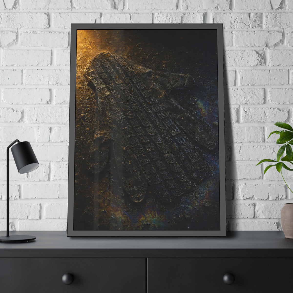 A flattened work glove on asphalt with a tire tread pressed across it. The Passage of the Wheel by Garabaggio, framed fine art print hanging in a room.