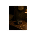 A nine volt battery on a nightstand below a wall smoke detector. The Battery Laid Below by Garabaggio, fine art print, 12″ x 16″.