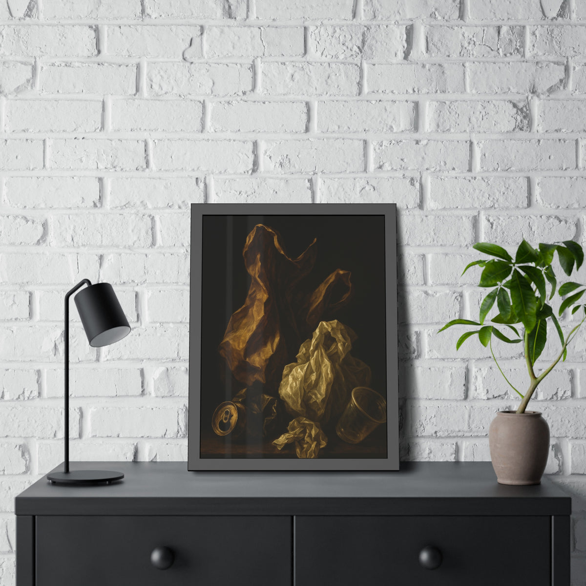 A plastic bag and crumpled paper beside a crushed can and clear cup. The Two Penitents by Garabaggio, framed fine art print hanging in a room.