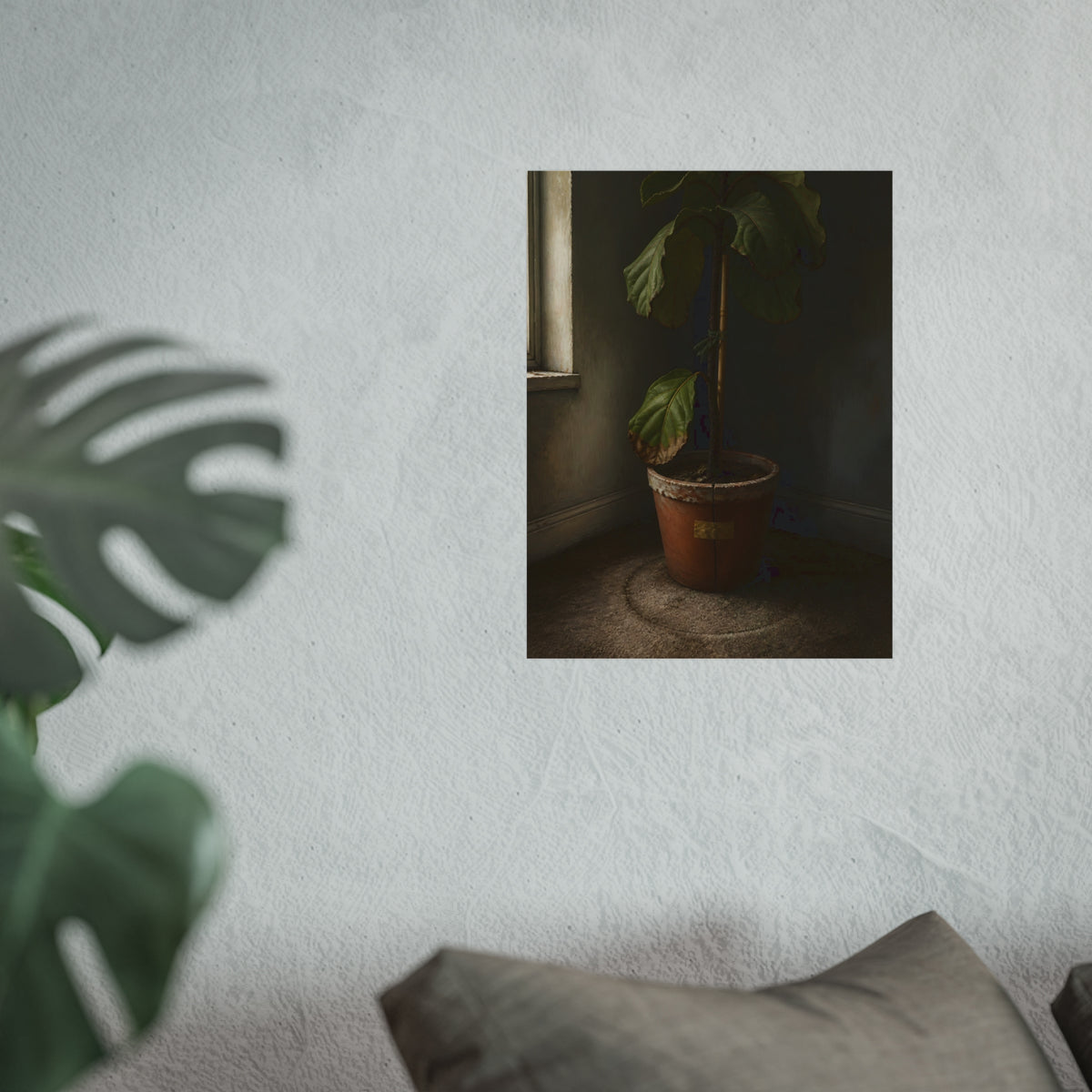 A leafy potted fig staked to a cane in a taped clay pot beside a window. The Corner by the Window by Garabaggio, fine art print hanging in a room.