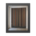Hundreds of extension cords hung floor to ceiling across a bright white room. The Cord Curtain by Garabaggio, framed fine art print, 11″ x 14″.
