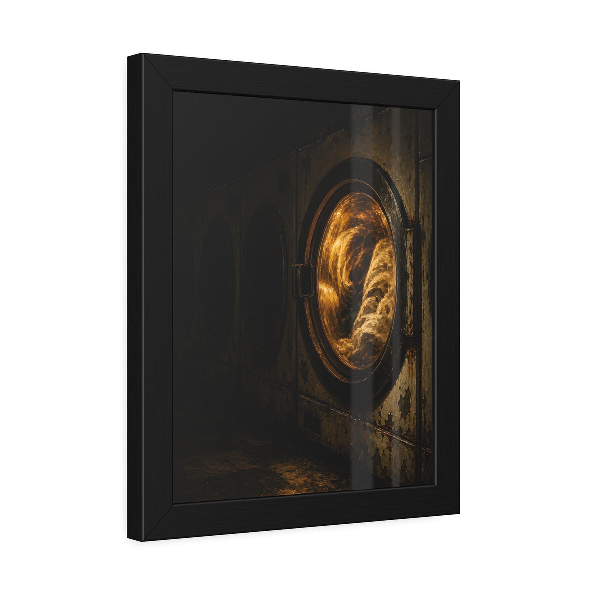 A row of dryers with one drum lit and tumbling in a dark laundromat. The Last Dryer Turning by Garabaggio, framed fine art print hanging in a room.