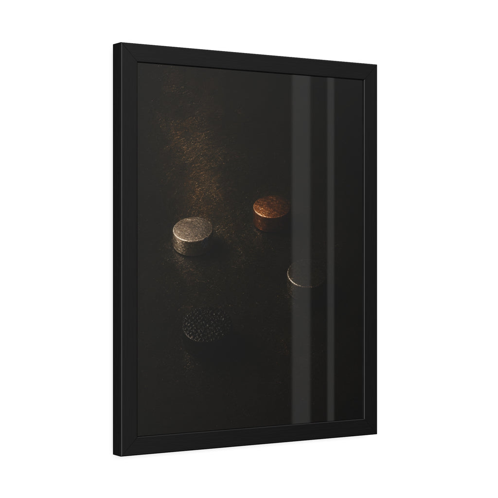 Four small metal discs on a dark scuffed surface in a narrow beam of light. Metals After the Song by Garabaggio, framed fine art print hanging in a room.
