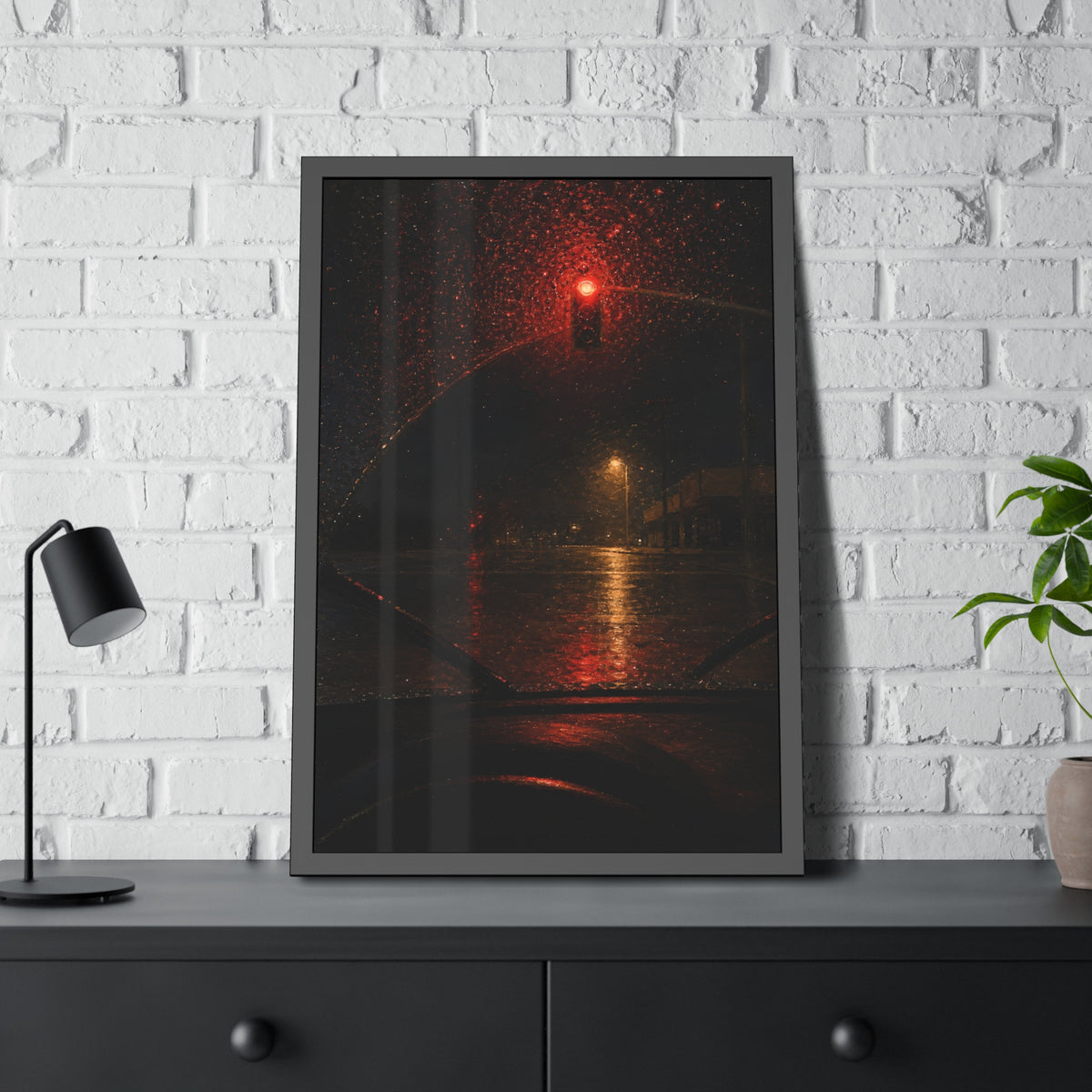 A red traffic light seen through a rain beaded windshield at night. The Windshield at the Red Light by Garabaggio, framed fine art print hanging in a room.