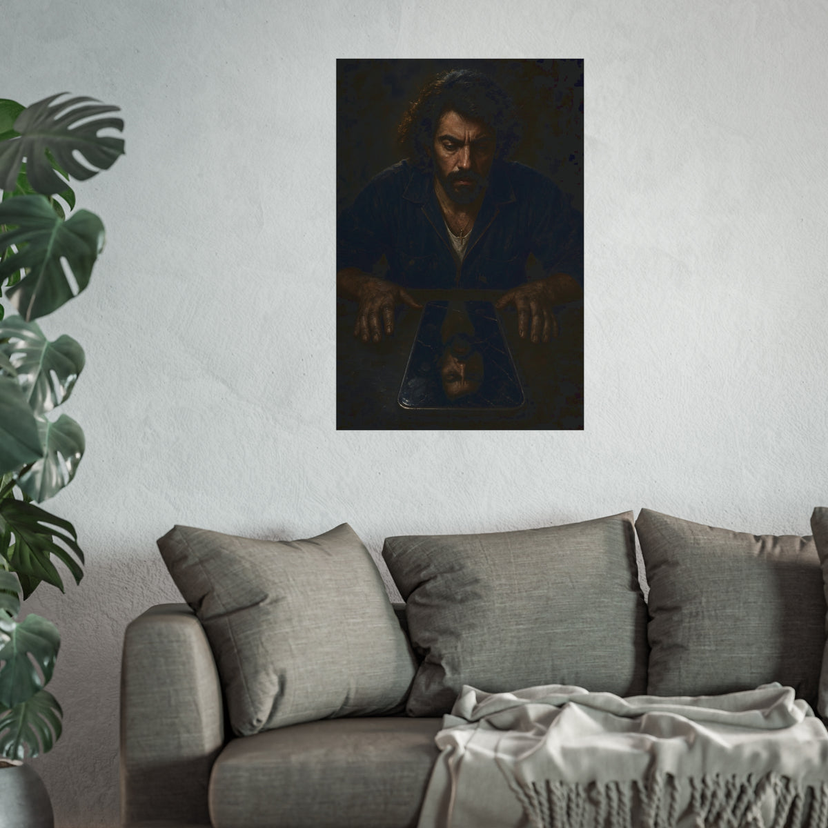 A bearded man in coveralls looking down at his face in a cracked screen. The Mirror After Midnight by Garabaggio, fine art print hanging in a room.