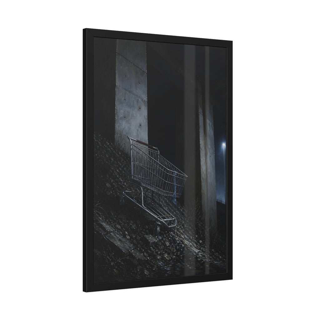 A shopping cart on a rocky slope under an overpass near a streetlamp. The Descent to the Underpass by Garabaggio, framed fine art print hanging in a room.