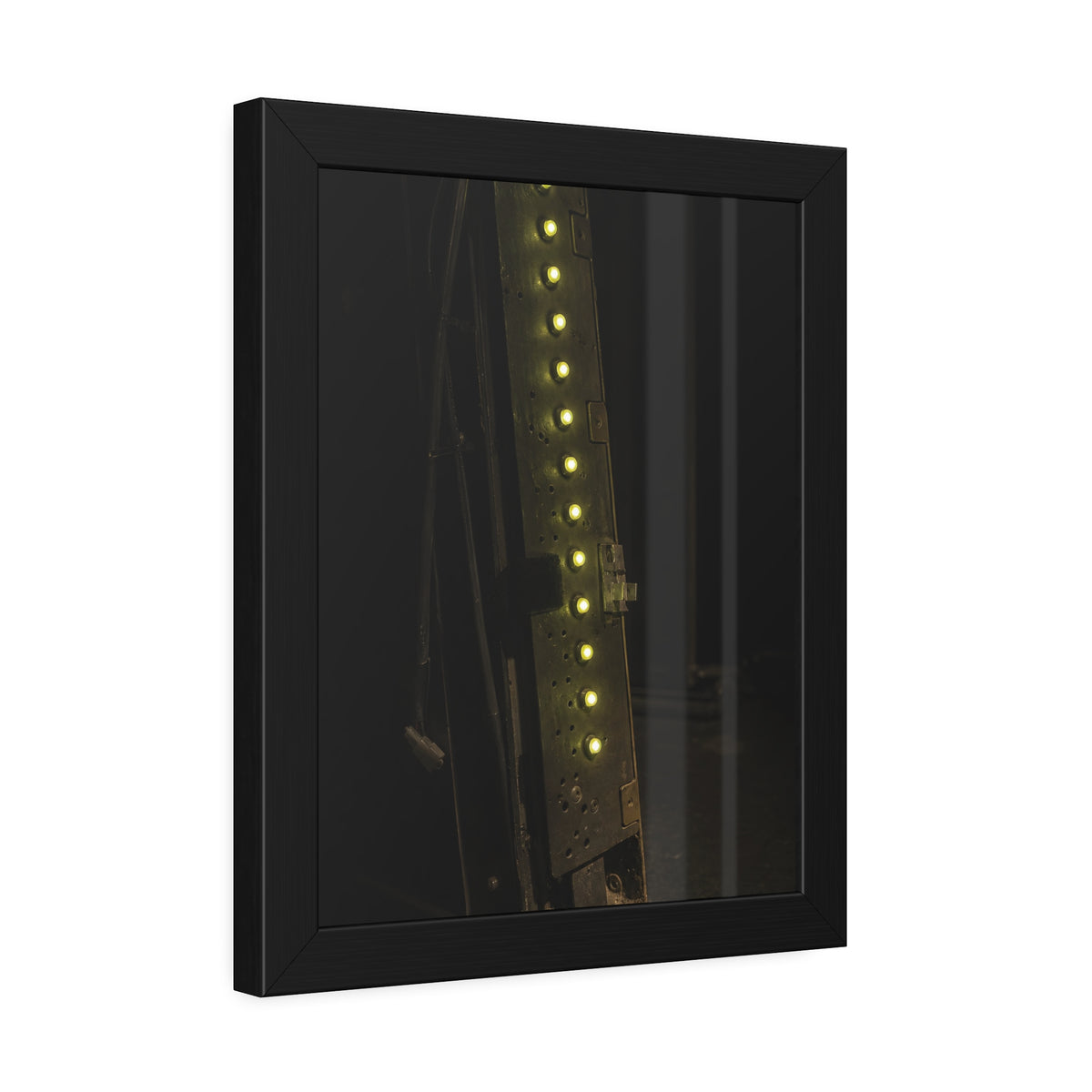 A dark rack panel with a vertical row of glowing green indicator lights. The First Green Choir by Garabaggio, framed fine art print hanging in a room.