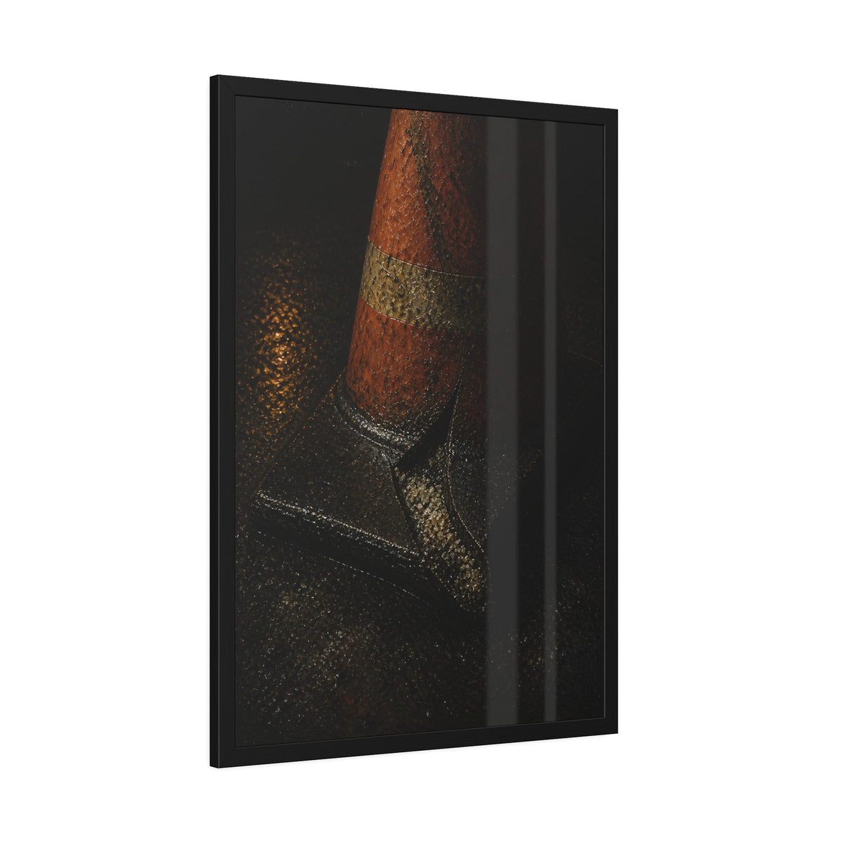 An orange traffic cone with a split base on wet asphalt at night. The Splitting of the Base by Garabaggio, framed fine art print hanging in a room.