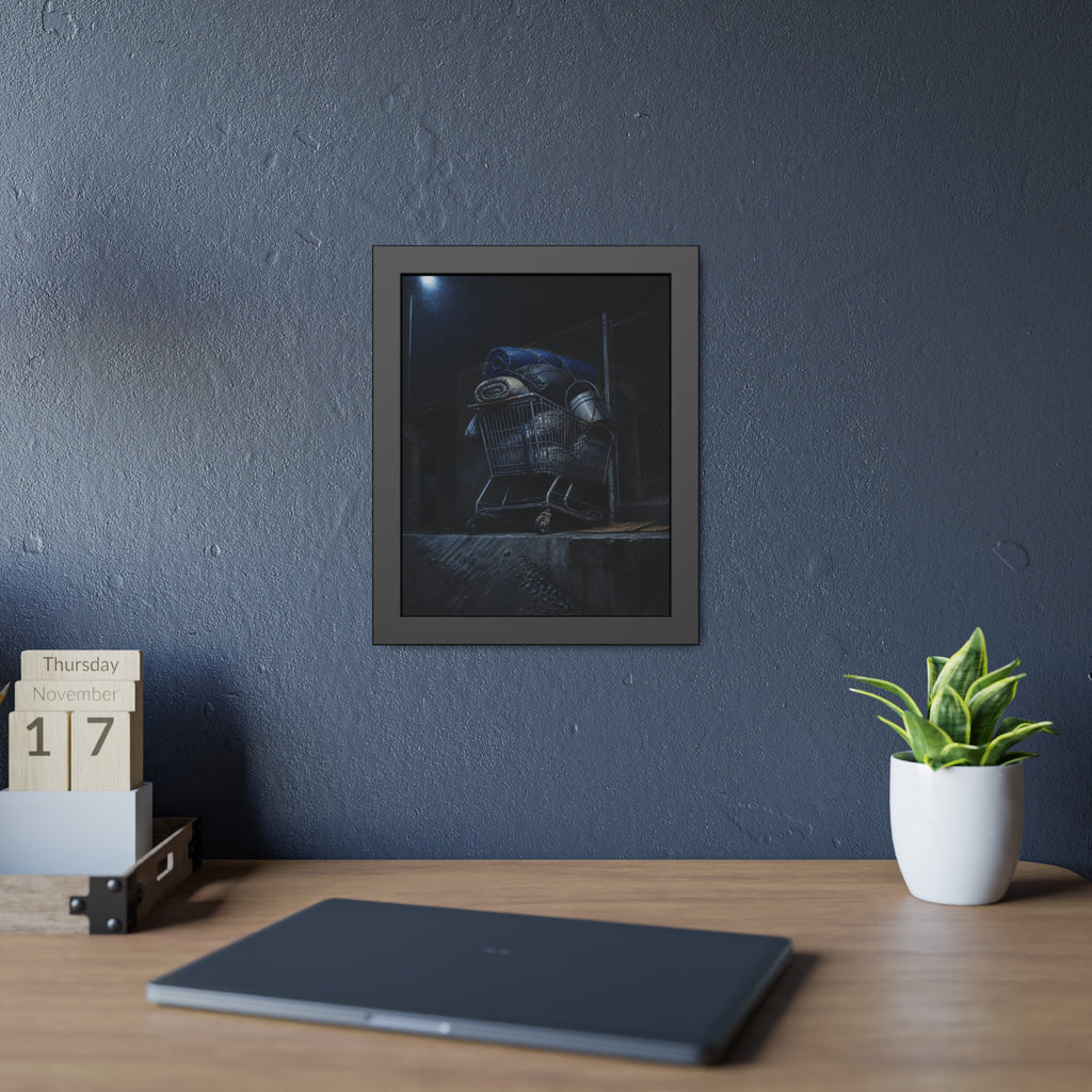 A shopping cart piled with bedding and buckets under a streetlamp. The Loading of Another Life by Garabaggio, framed fine art print hanging in a room.