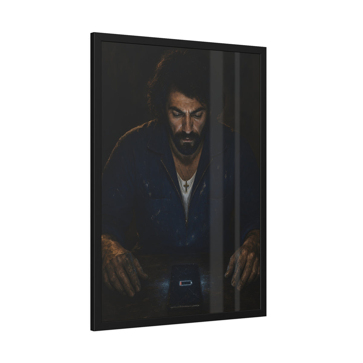 A man in a work jacket looks down at a phone showing a red low battery icon. The Calling at One Percent by Garabaggio, framed fine art print hanging in a room.