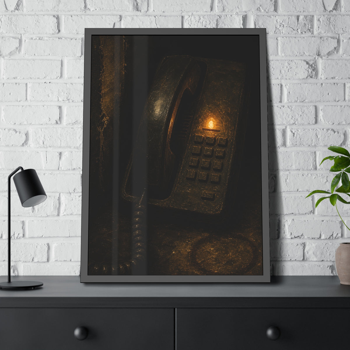 An old desk phone in the dark with one amber line light glowing. The First Ring by Garabaggio, framed fine art print hanging in a room.
