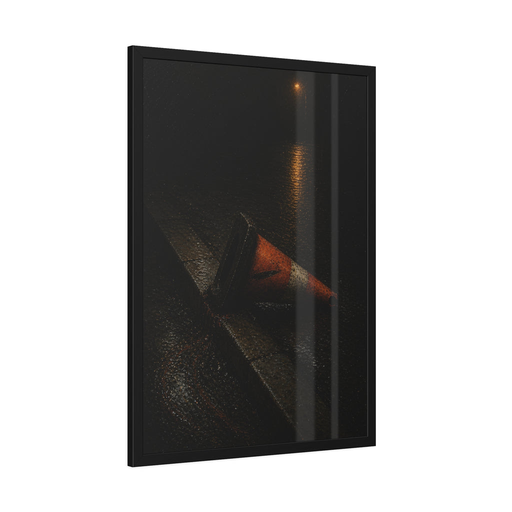 An orange traffic cone toppled on a wet curb under a distant streetlamp. The Dragging Through Rain by Garabaggio, framed fine art print hanging in a room.