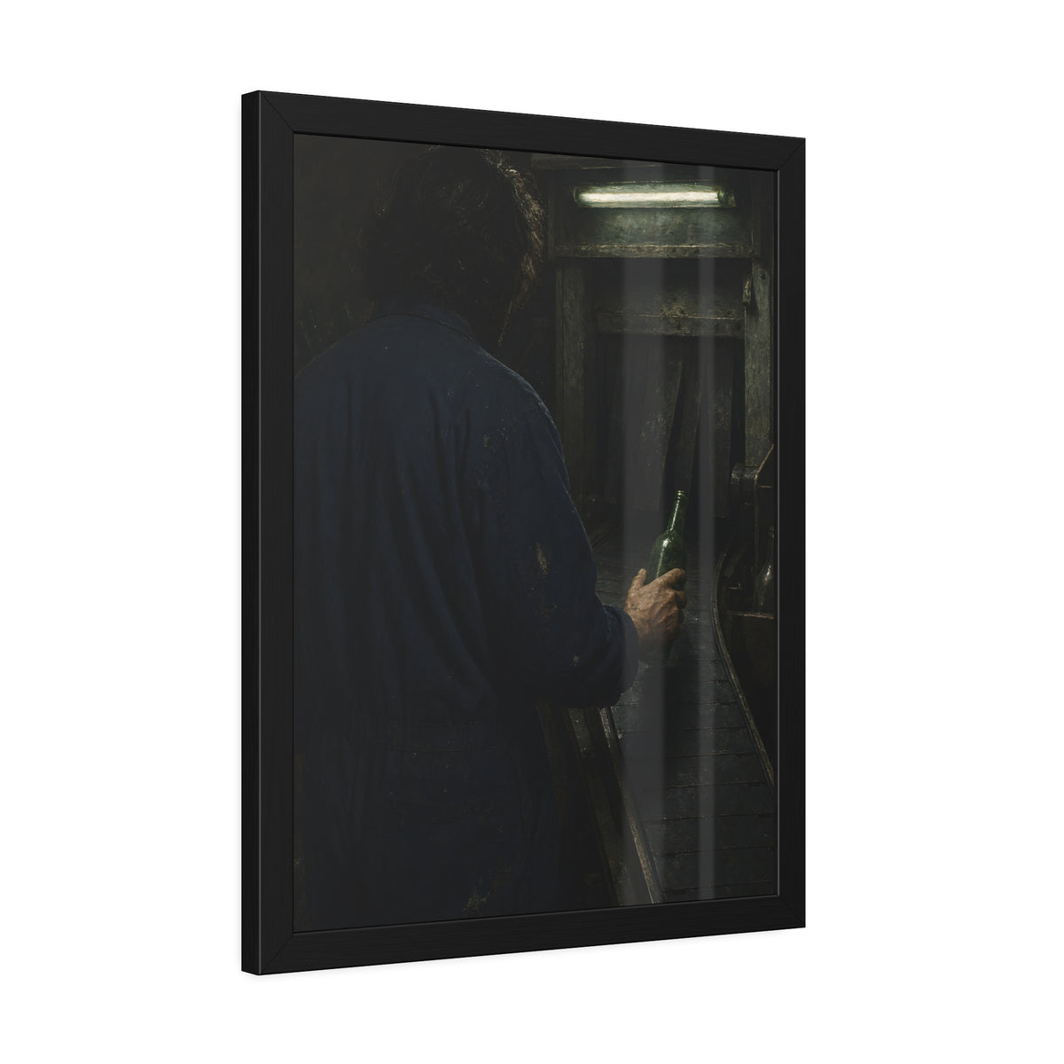 A man in coveralls sets a green bottle on a conveyor under a strip light. Garabaggio at the Conveyor by Garabaggio, framed fine art print hanging in a room.