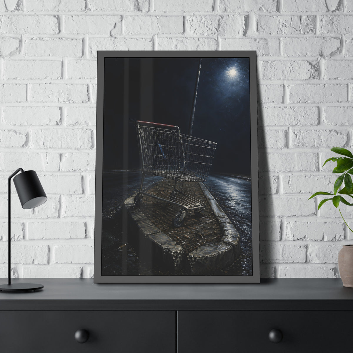A shopping cart stranded on a stone median under a streetlight. The Crossing of the Median by Garabaggio, framed fine art print hanging in a room.