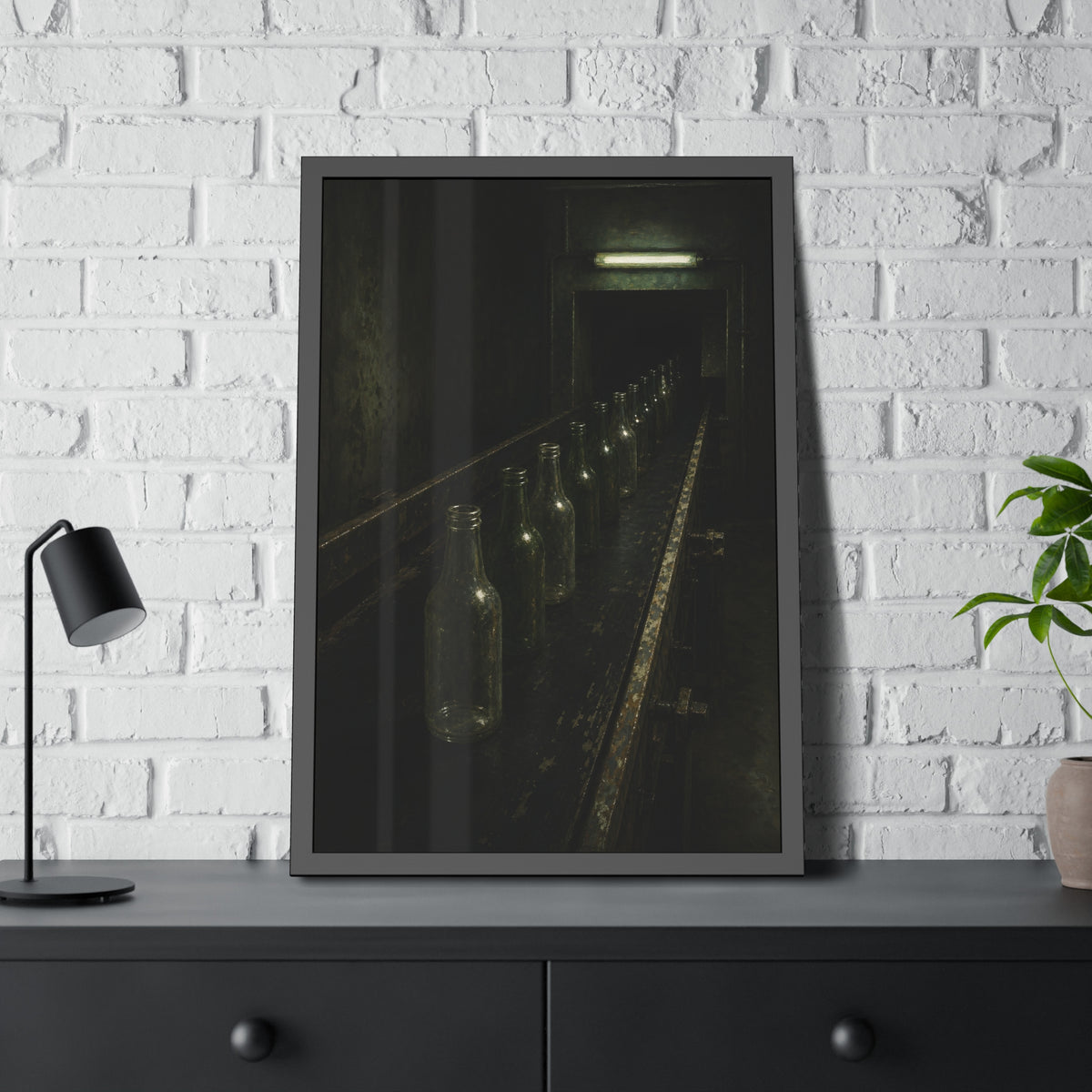 Empty glass bottles in a line on a conveyor under one fluorescent tube. The Procession of Bottles by Garabaggio, framed fine art print hanging in a room.