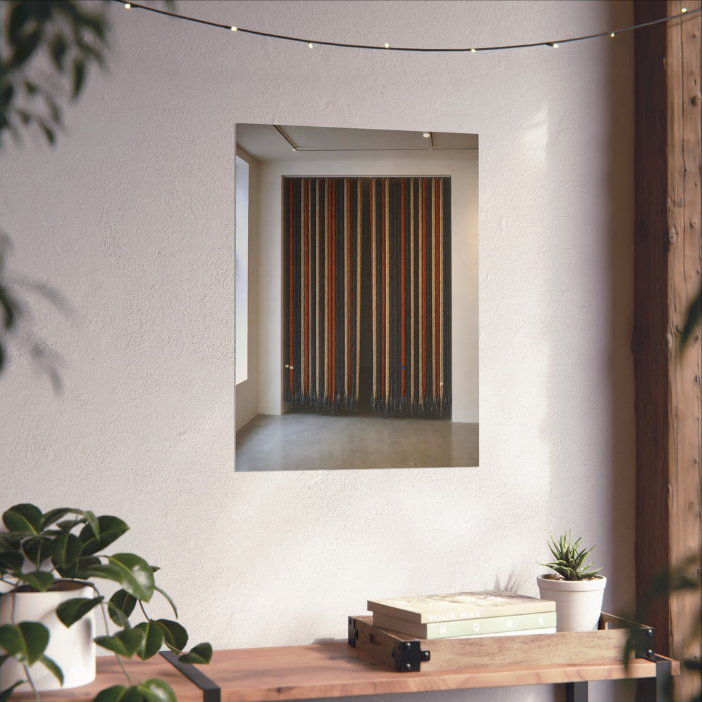 Hundreds of extension cords hung floor to ceiling across a bright white room. The Cord Curtain by Garabaggio, fine art print hanging in a room.