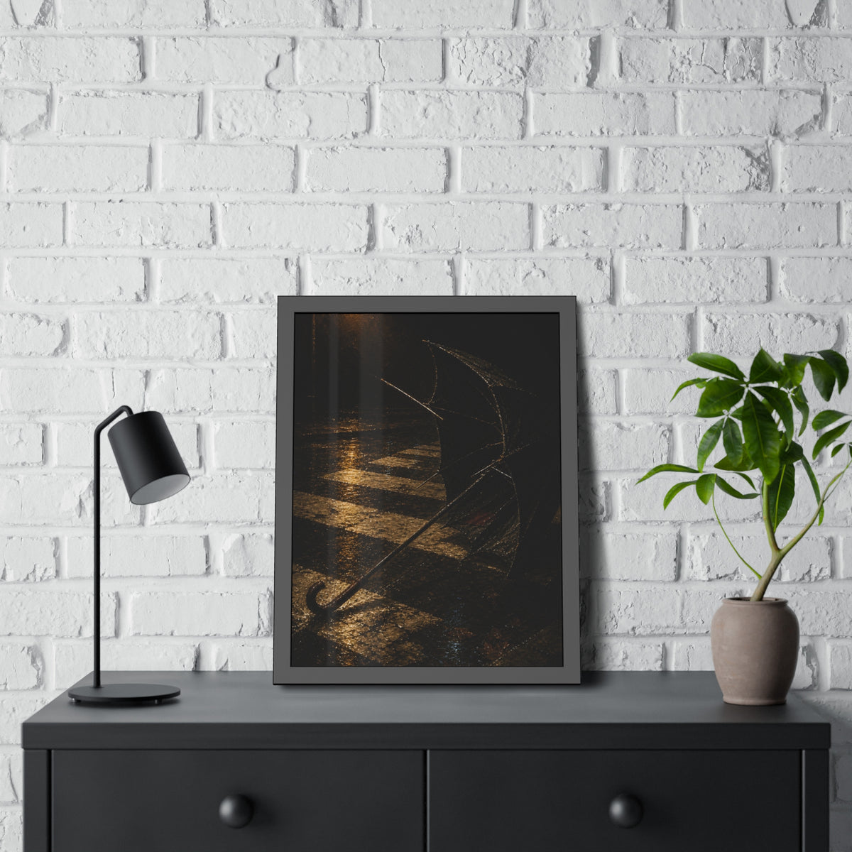 A blown out umbrella lying on wet checkered pavement under a street lamp. The Taking by the Wind by Garabaggio, framed fine art print hanging in a room.