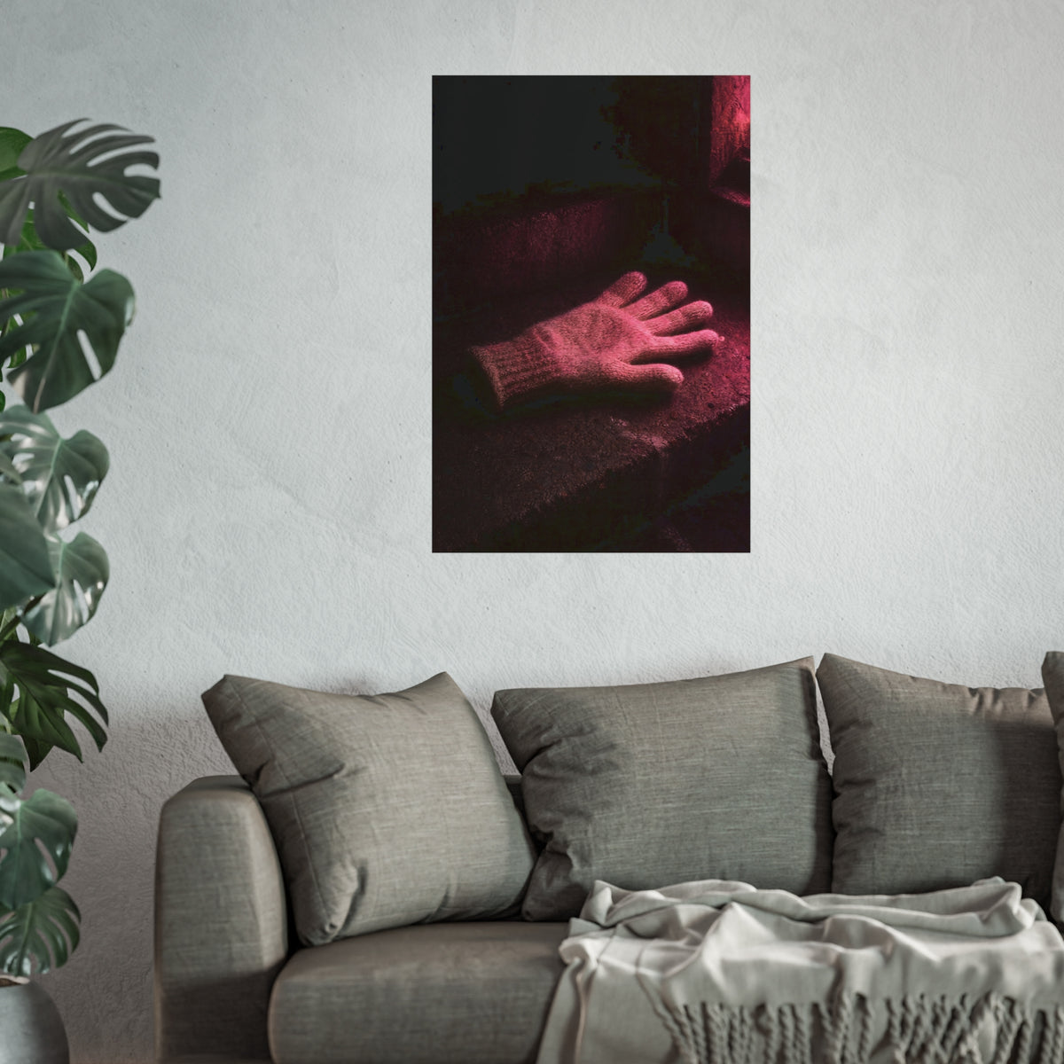 A knitted glove lying flat on a concrete step under pink light. The Vigil in Pink Light by Garabaggio, fine art print hanging in a room.