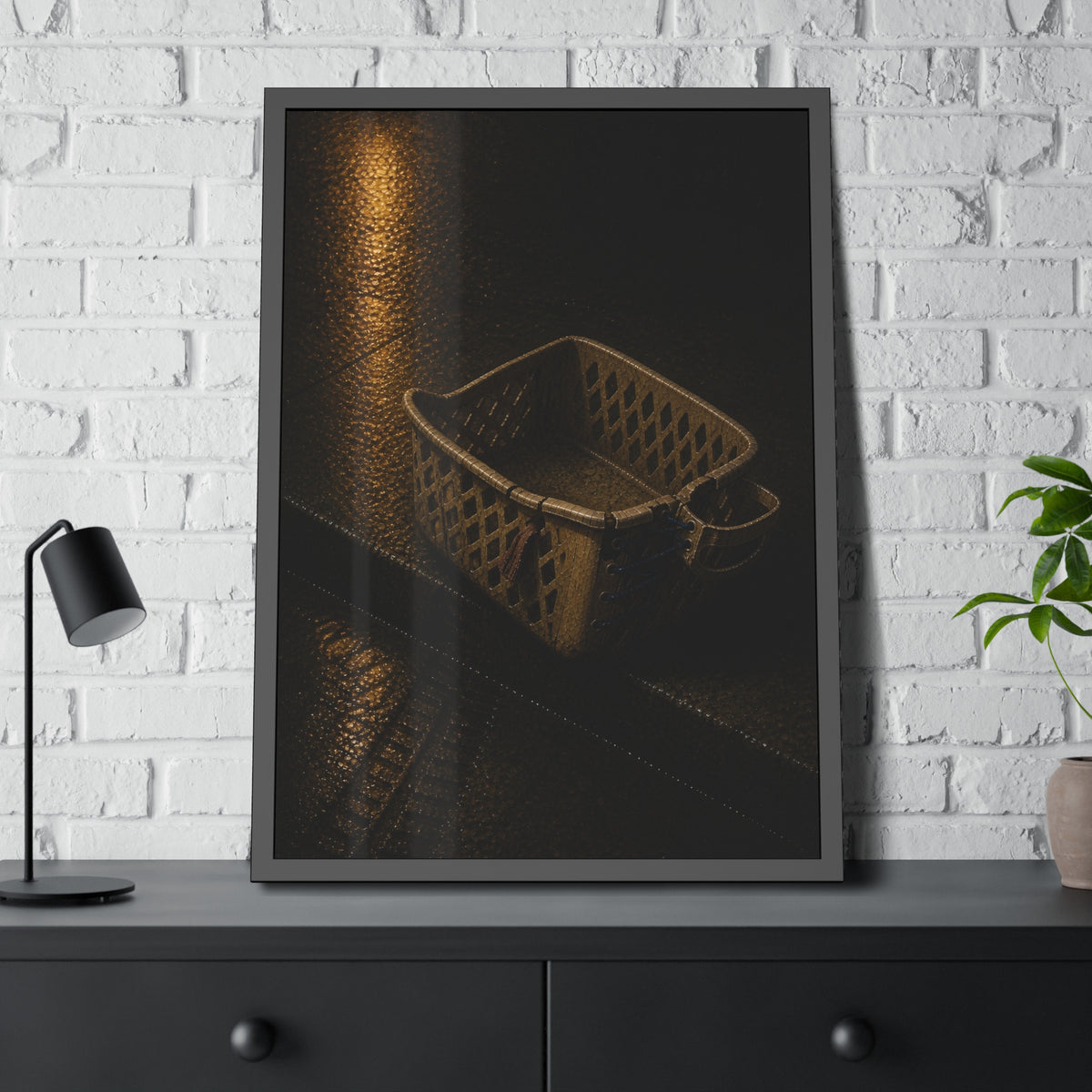 A cracked plastic laundry basket with a warped rim on wet asphalt. The Crushing of the Rim by Garabaggio, framed fine art print hanging in a room.