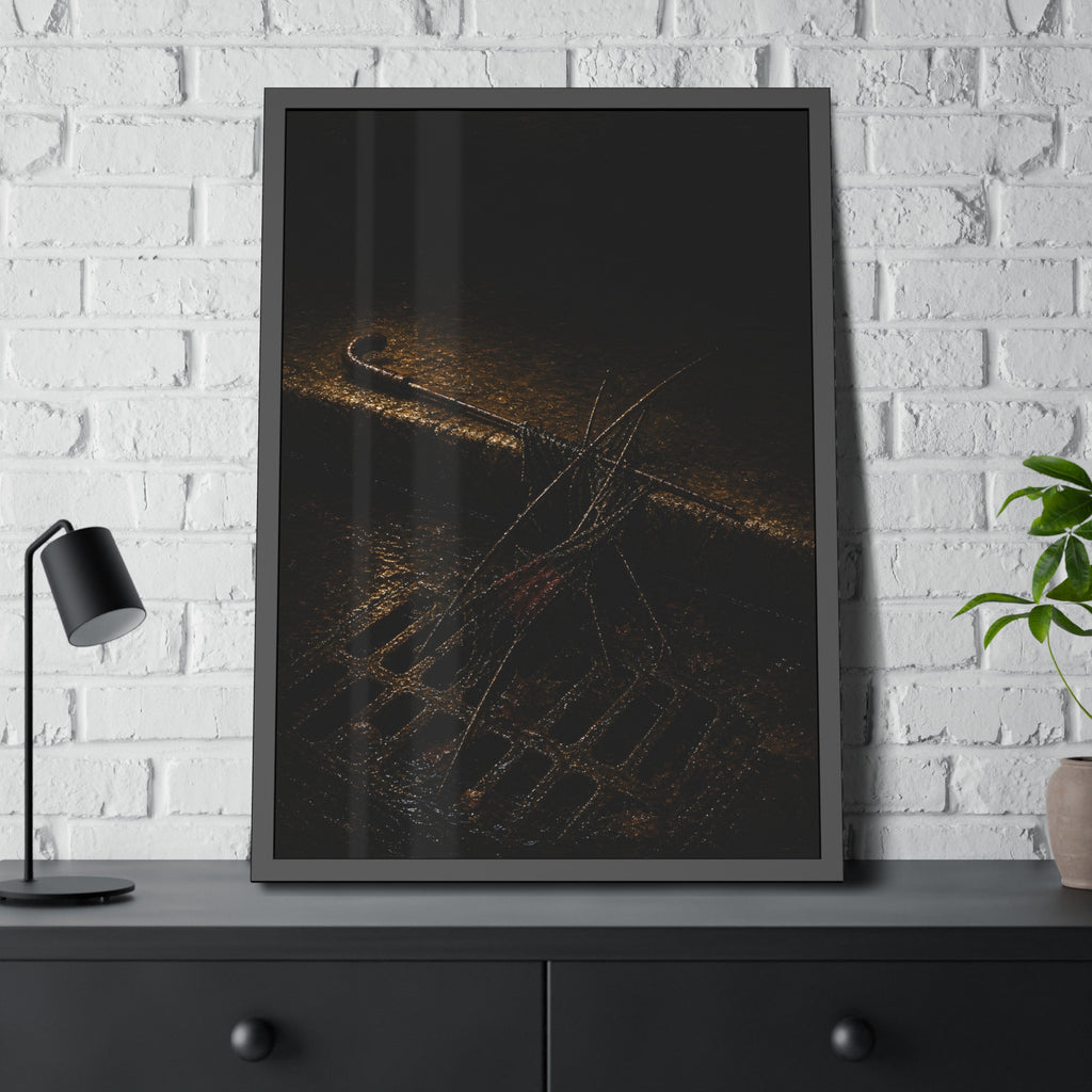 A broken umbrella collapsed across a storm drain grate at the curb. The Burial at the Storm Drain by Garabaggio, framed fine art print hanging in a room.