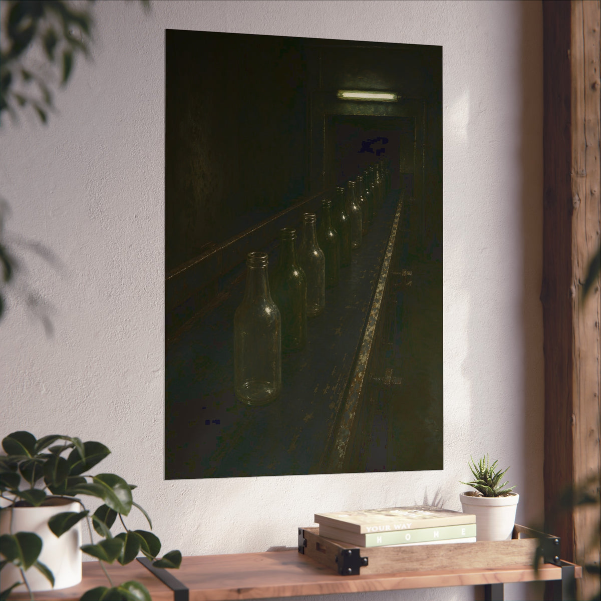 Empty glass bottles in a line on a conveyor under one fluorescent tube. The Procession of Bottles by Garabaggio, fine art print hanging in a room.