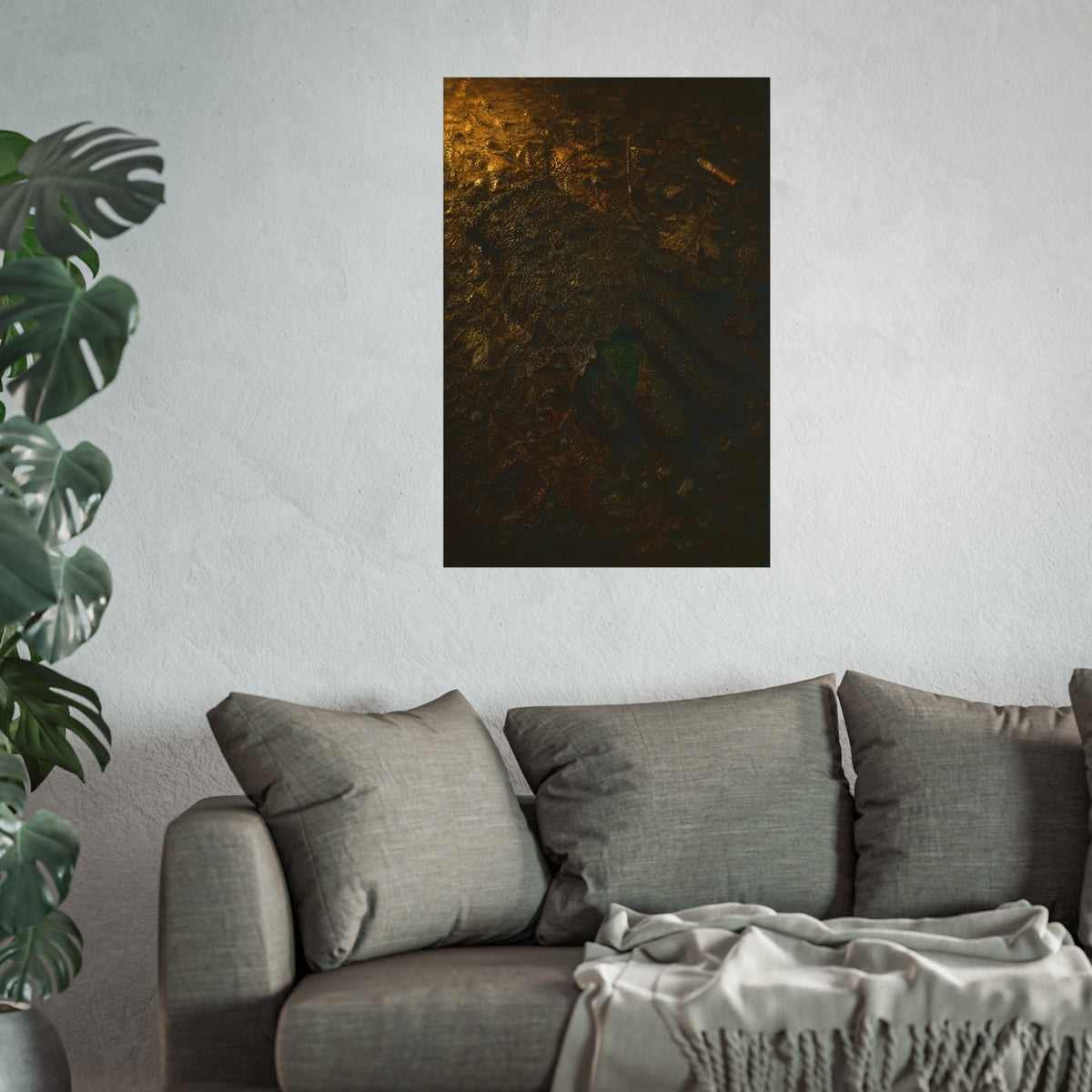 Wet mud and pressed oak leaves with a green scrap barely showing. The Reliquary of Mud and Leaf by Garabaggio, fine art print hanging in a room.