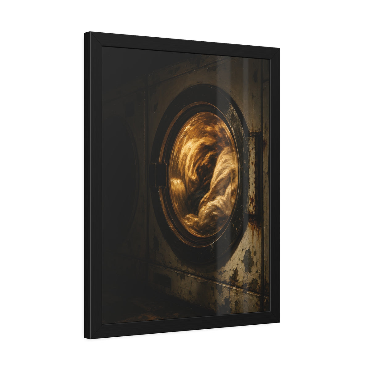 A washer drum tumbling laundry lit amber behind its glass door. The First Spin by Garabaggio, framed fine art print hanging in a room.