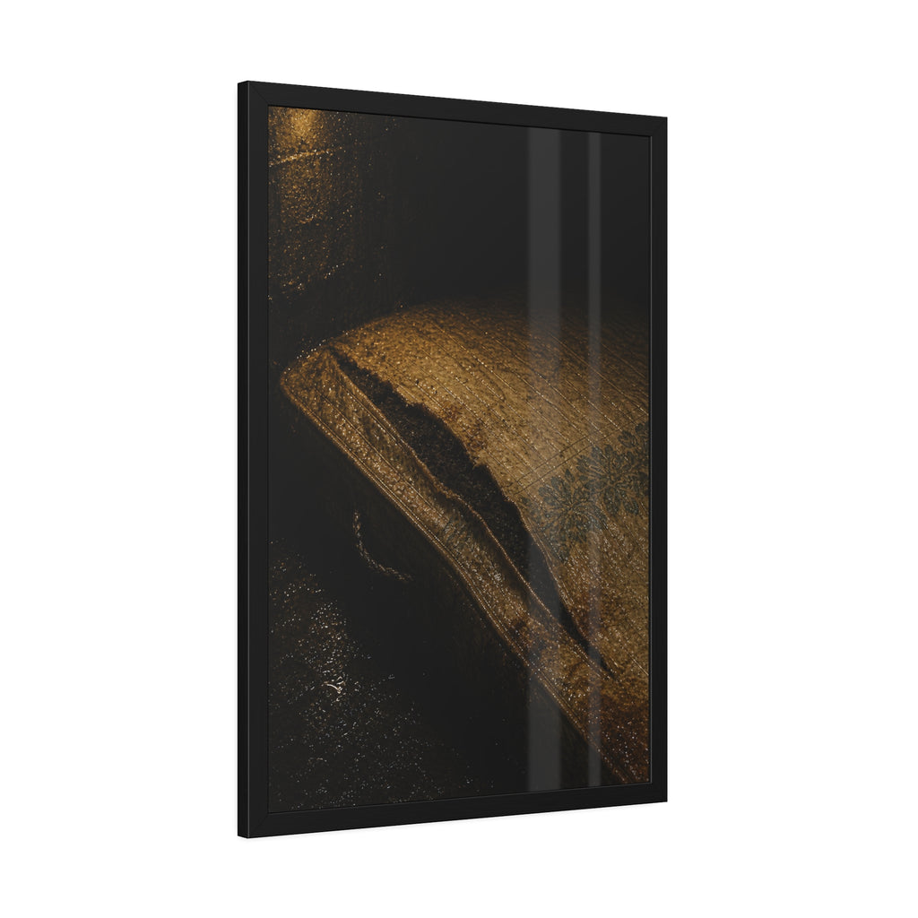 A mattress with its seam split open, lit warm against a dark wall. The Opening of the Ticking by Garabaggio, framed fine art print hanging in a room.
