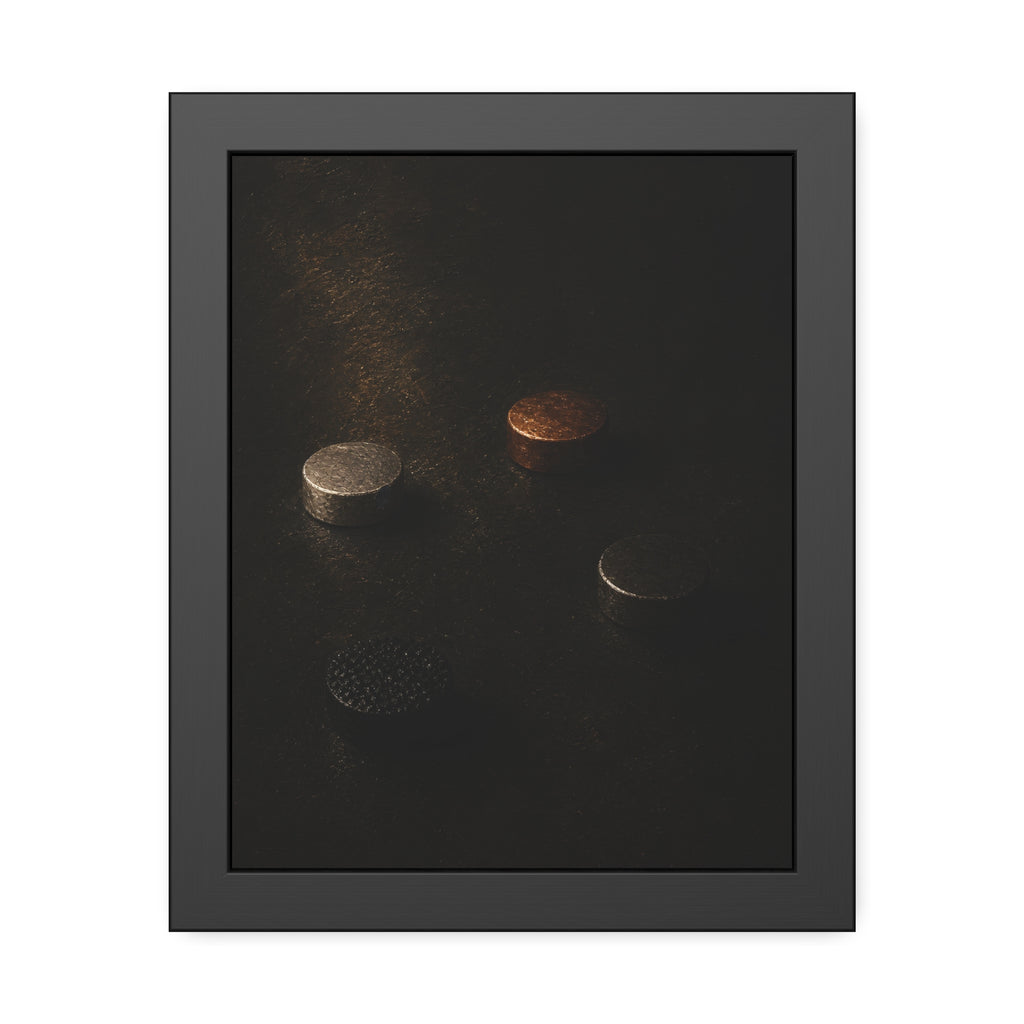 Four small metal discs on a dark scuffed surface in a narrow beam of light. Metals After the Song by Garabaggio, framed fine art print, 11″ x 14″.