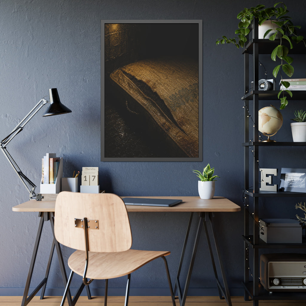 A mattress with its seam split open, lit warm against a dark wall. The Opening of the Ticking by Garabaggio, framed fine art print hanging in a room.