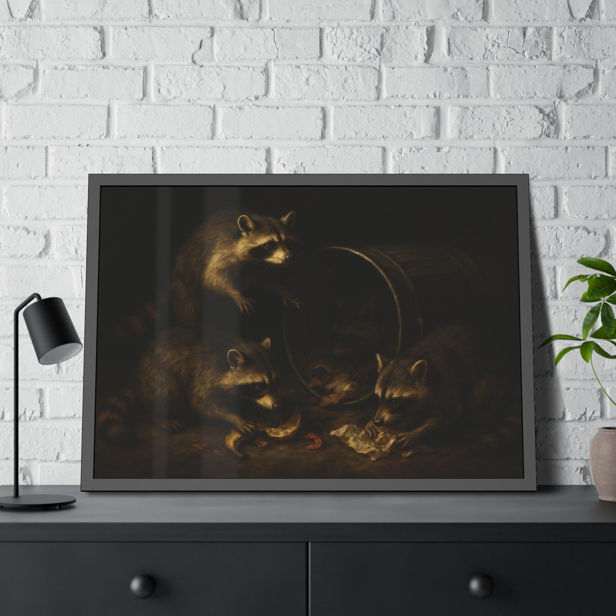Raccoons at a tipped metal pail, one gnawing a melon rind in the dark. The Supper at the Alleyway by Garabaggio, framed fine art print hanging in a room.