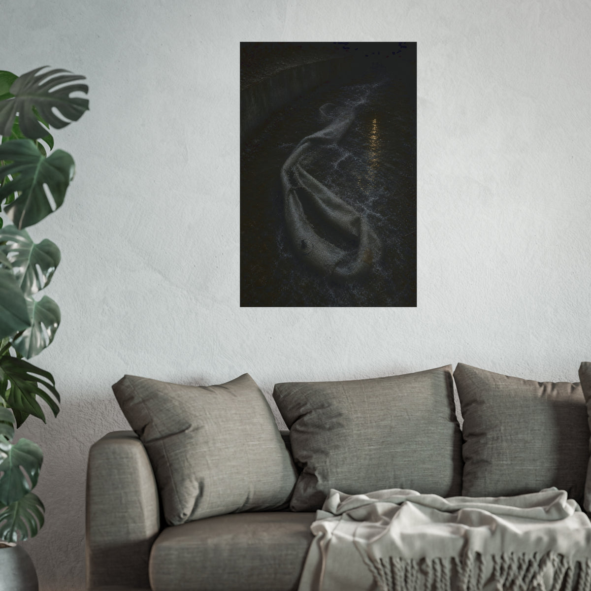 A deflated pool float caught in a concrete drainage channel of running water. The Release into Runoff by Garabaggio, fine art print hanging in a room.
