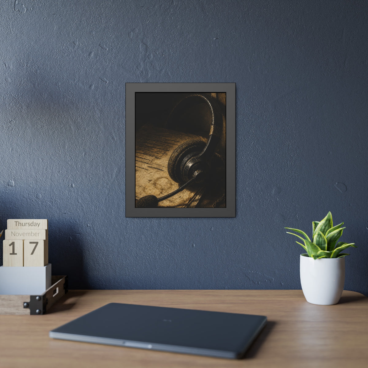 A worn headset resting on a printed script page with coffee rings. The Script Beside the Mouthpiece by Garabaggio, framed fine art print hanging in a room.