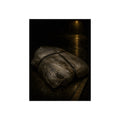 A mattress wrapped in plastic and strapped shut on a wet night street. The Municipal Shroud by Garabaggio, fine art print, 12″ x 16″.