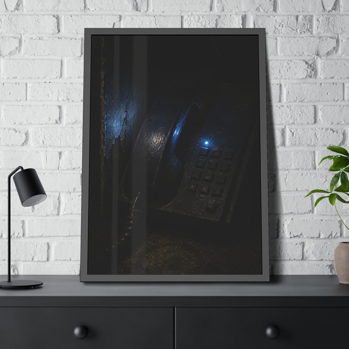 A grimy wall telephone in darkness with one small blue indicator light. The Night Queue by Garabaggio, framed fine art print hanging in a room.