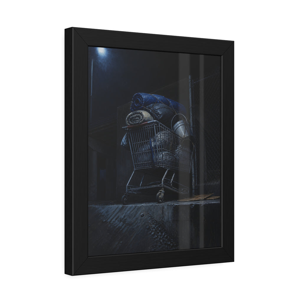 A shopping cart piled with bedding and buckets under a streetlamp. The Loading of Another Life by Garabaggio, framed fine art print hanging in a room.