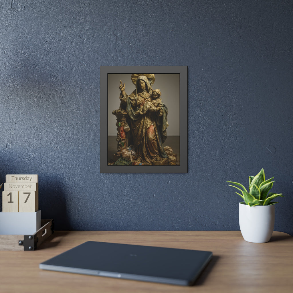 A standing veiled figure holding a child, refuse piled around the base. The Virgin of the Landfill by Garabaggio, framed fine art print hanging in a room.