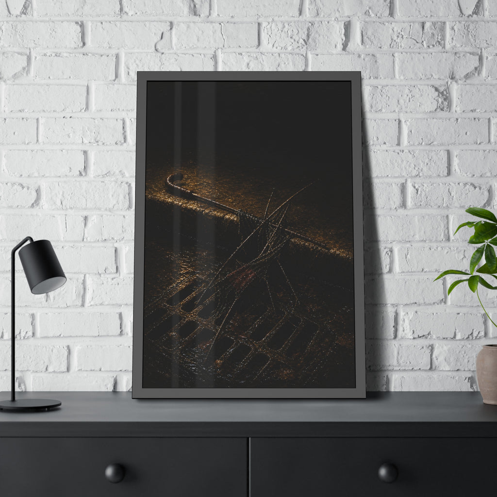 A broken umbrella collapsed across a storm drain grate at the curb. The Burial at the Storm Drain by Garabaggio, framed fine art print hanging in a room.