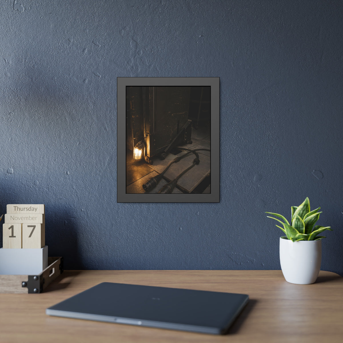 Two thick power cables unplugged on the floor beside a caged work lamp. The Redundant Power by Garabaggio, framed fine art print hanging in a room.
