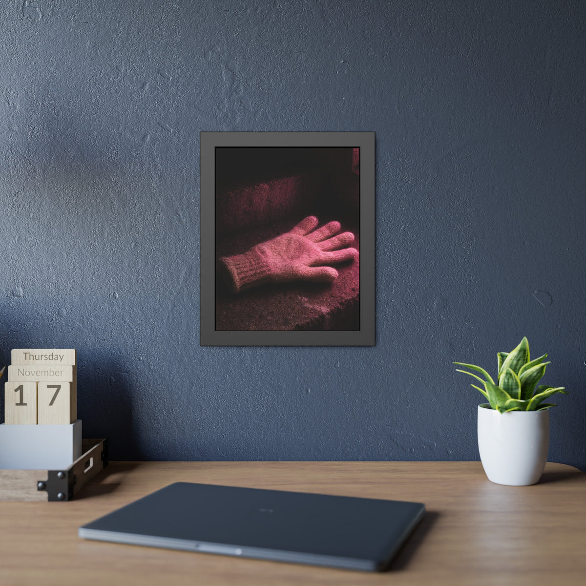 A knitted glove lying flat on a concrete step under pink light. The Vigil in Pink Light by Garabaggio, framed fine art print hanging in a room.